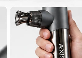 AXIS massage gun held in a hand
